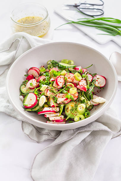 Spring fresh cucumber and radish salad with chives