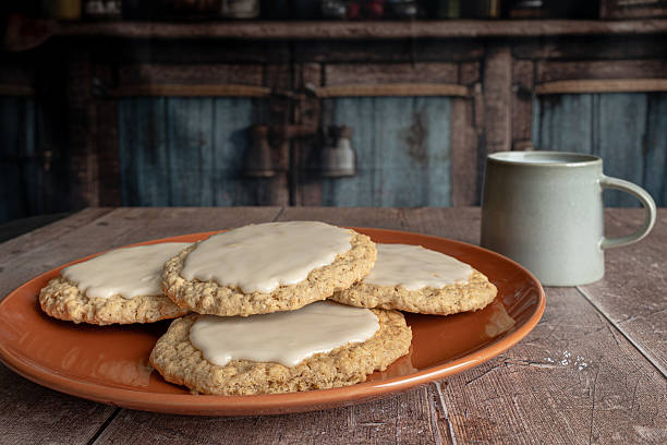 Glazed Oatmeal Cookies on Terracotta Plate in Rustic Vintage Kitchen