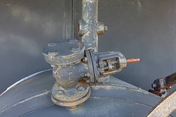 Industrial pipe and valve showing rust and wear in a historic mining complex