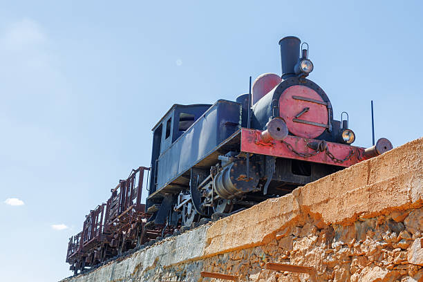 Lousal, Portugal - March 11, 2026: Vintage steam locomotive and wagons at the abandoned mining complex in minas do lousal, portugal