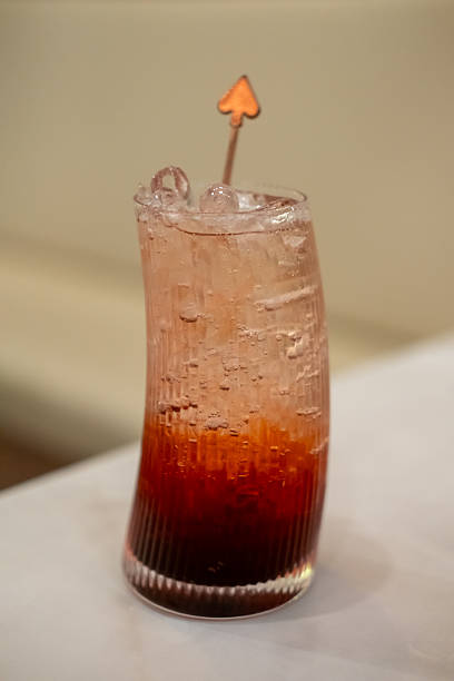 Tropical drink juice in a glass on the wooden table