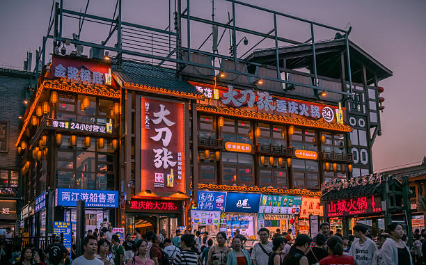 Colorful illuminated signs and shops inside the Hongya Cave in central downtown Chongqing, China