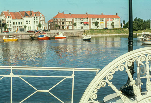The historic Spijkerbrug in Middelburg, seen in the foreground, with boats in the marina in the background. Taken in 1974-1975, this editorial image captures the cityscape and waterways of Zeeland during the 1970s. circa 1974-1975, Middelburg, Zeeland, The Netherlands