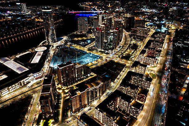 Impressive scenery of the new part of Belgrade and its tall buildings by the river seen from a drone perspective at night with all the lights.