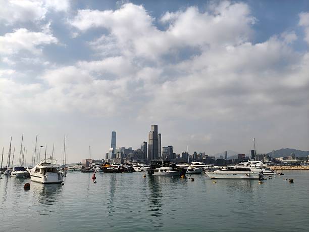 Causeway Bay Typhoon Shelter is filled with boats, and distant skyscrapers seem to be floating on the water