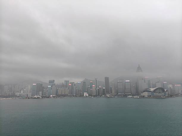 Under the thick fog, the grey sky and city