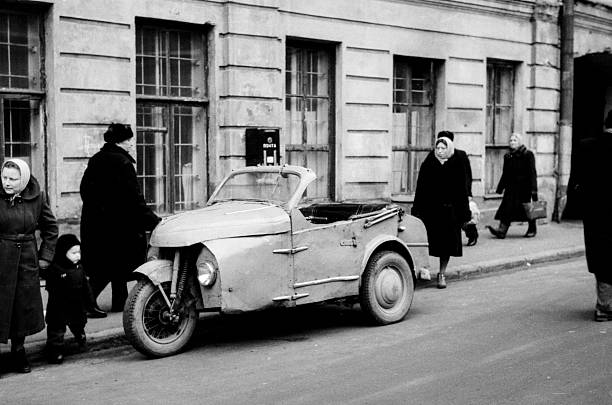Moscow, Russia, - October 1, 1960: unidentified tricycle car-scooter parked on street