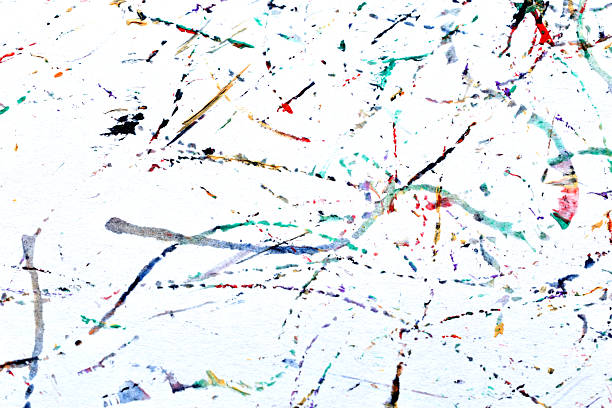 Spots, splashes and streaks of watercolor paint on a white background.