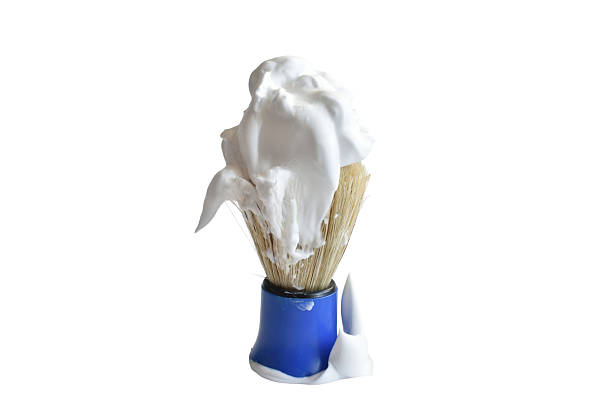 Shaving brush with blue handle and foam isolated on white background.