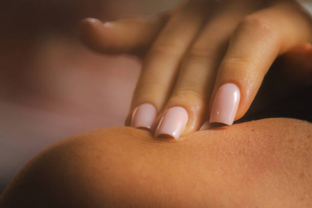 Elegance young woman hand with pink polish nail manicure.