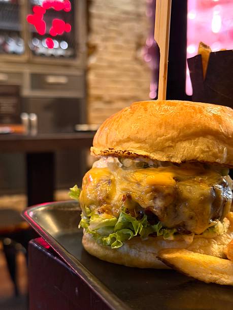 Premium gourmet cheeseburger with mature meat and fries
