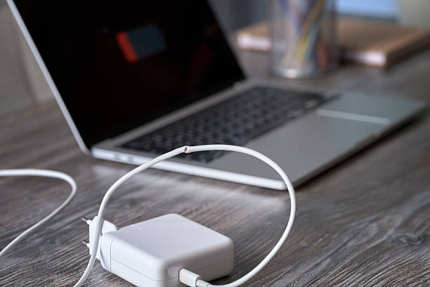 A damaged laptop charger cable and charger.
