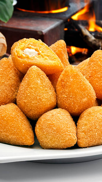 Coxinha de Galinha - Brazilian deep fried chicken snack, popular at local parties. Served with chili sauce.
