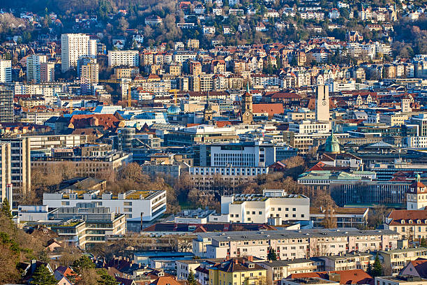 Stuttgart city skyline at blue hour – panoramic night view of Stuttgart, Germany with illuminated downtown, valley cityscape and TV towers on surrounding hills