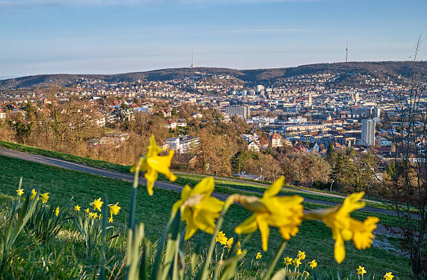 Stuttgart city skyline at blue hour – panoramic night view of Stuttgart, Germany with illuminated downtown, valley cityscape and TV towers on surrounding hills