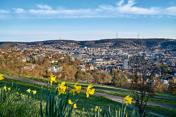 Stuttgart city skyline at blue hour – panoramic night view of Stuttgart, Germany with illuminated downtown, valley cityscape and TV towers on surrounding hills