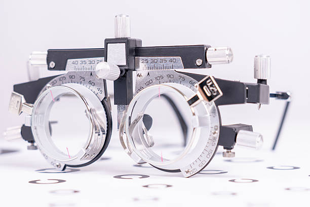 A pair of eyeglasses with a black frame and a white lens