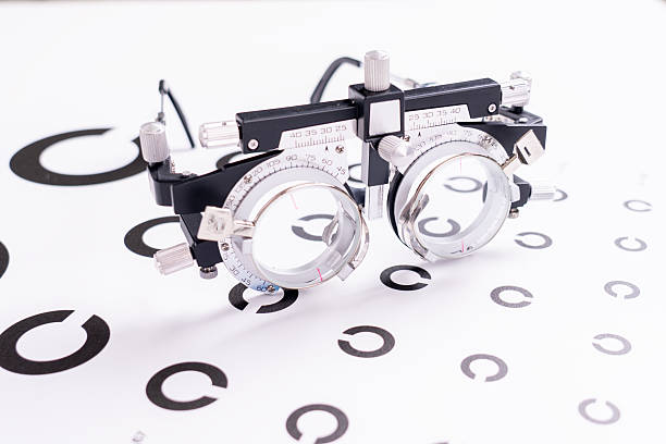A pair of eyeglasses with a black frame and a white lens
