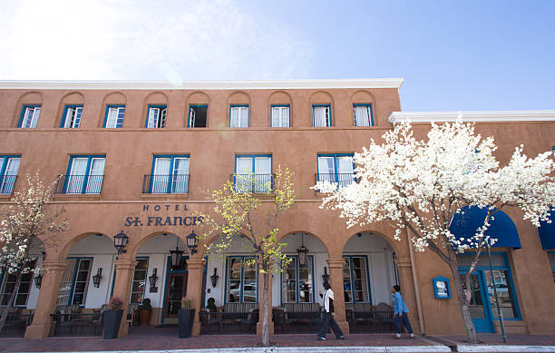 Santa Fe, NM - March 15, 2026: A white flowering tree in front of Hotel St Francis; the hotel—the oldest in Santa Fe—is just one block from the historic Santa Fe Plaza.