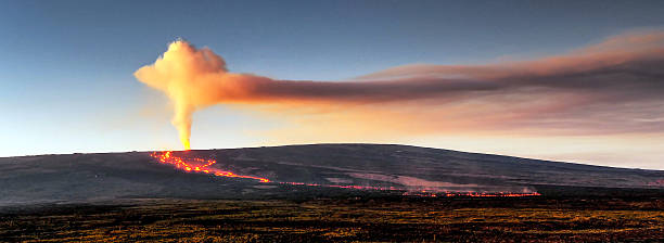 In 2022 Mauna Loa, the world's largest volcano, erupted for 14 days from November 27 to December 10. The eruption occurred from the Northeast Rift Zone. A view of the lava flow and volcanic plume taken during morning twilight from the Saddle Road region of the Big Island of Hawaii.