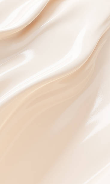 Abstract background of smooth beige liquid foundation cosmetic cream texture with copy space 3D render