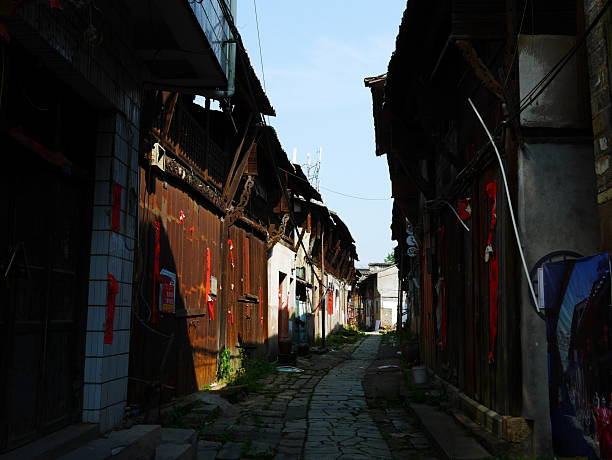 Narrow alley between old wooden buildings