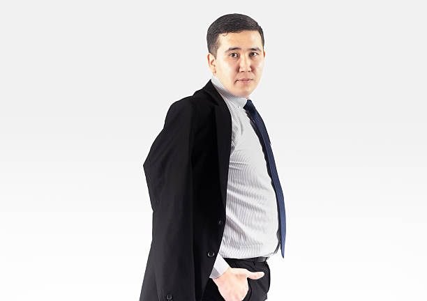 Handsome male model posing in semi formal clothes on white background.
