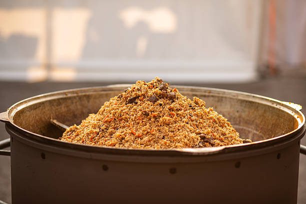 A large pot pilaf filled with freshly cooked, aromatic rice mixed with meat, vegetables, and spices, ready to serve.