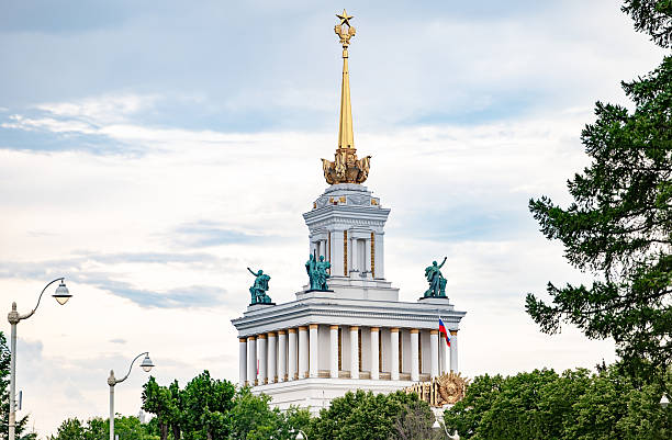 VDNH central pavilion showcasing historic Moscow landmark with golden spire and statues