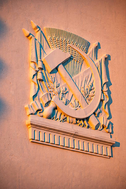 Soviet Union hammer and sickle relief, combining worker and peasant symbols, representing communism ideology