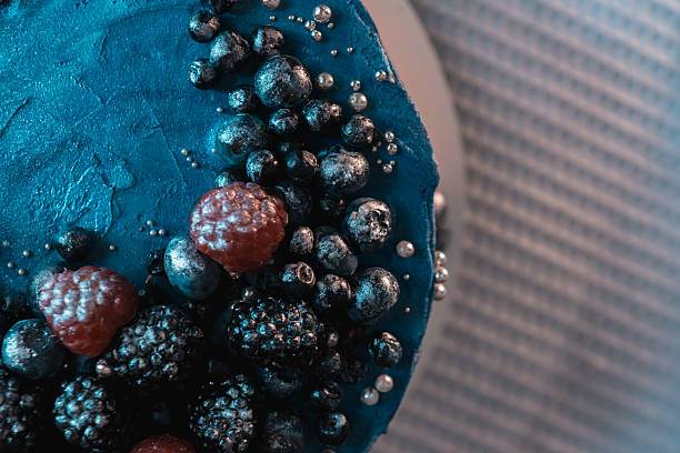 Blue cake top with berries and silver decoration