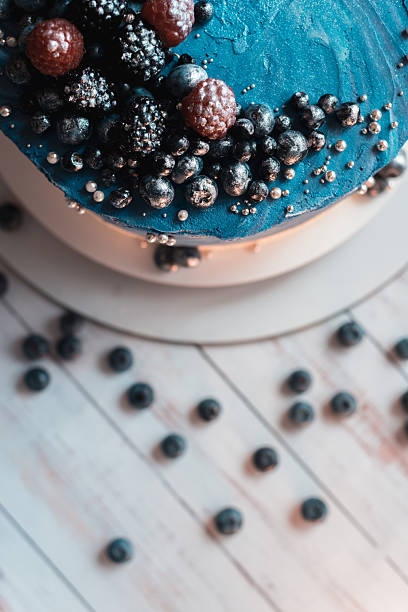 Blue cake with berries close up top edge