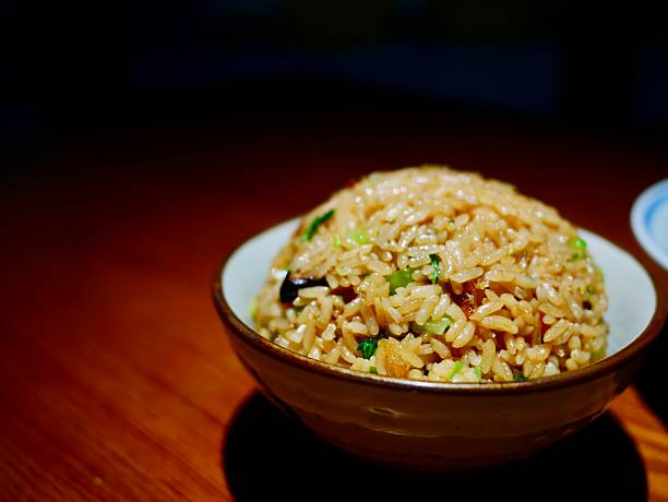 Bowl of fried rice with green onions