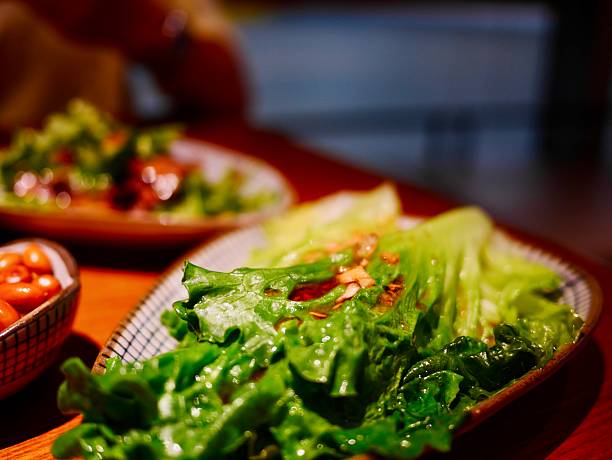 Fresh green lettuce served on wooden table