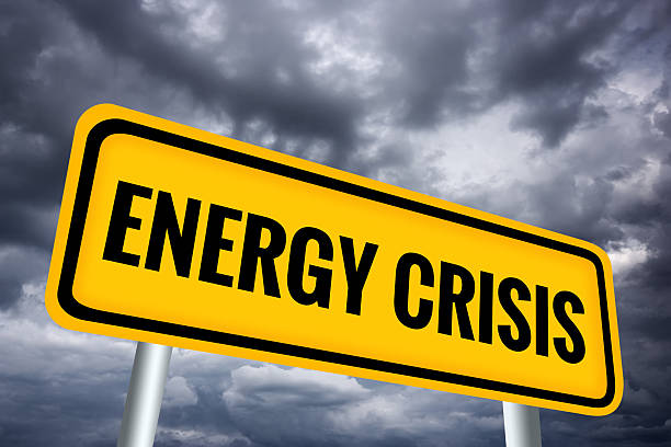 Energy Crisis illustrated warning sign over dark gloomy sky