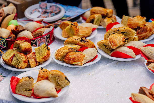 Diverse Array Of Flaky And Layered Pastries Arranged For Tasting At Lively Outdoor Market