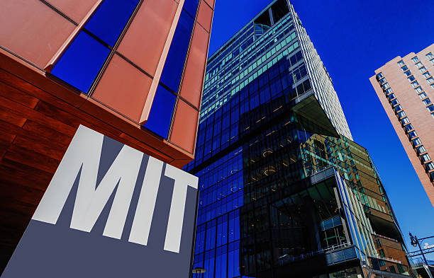 Cambridge, Massachusetts, USA - March 10, 2026: MIT sign at the edge of the Massachusett Institute of Technology campus near Kendall Square buildings. Massachusetts Institute of Technology (MIT) is a private reseach university founded in 1861. It has played a key role in the development of many aspects of modern science, engineering, mathematics, and technology, and is widely known for its innovation and academic strength. Kendall Square is an internationally recognized innovation distirct because of its high concentration of entrepreneurial startups. It is adjacent to the MIT campus and has about 50,000 people who work in the area on a daily basis.