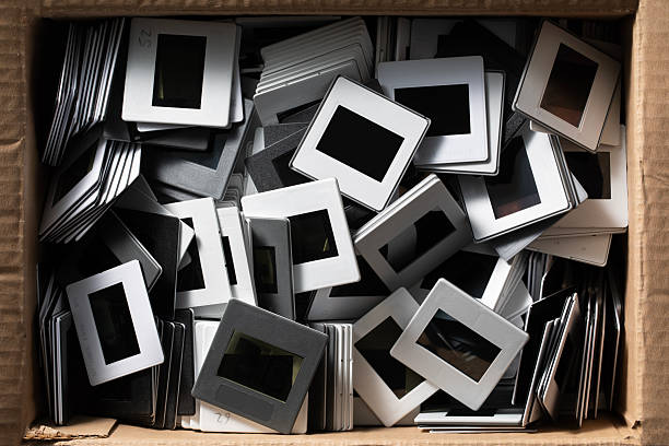 Stack of 35mm slides in a cardboard box