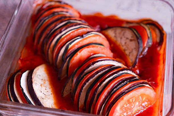 Homemade Ratatouille in Glass Baking Dish with Sliced Vegetables and Tomato Sauce