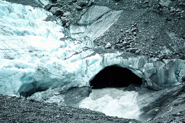 outflow from glacial cave in terminus of glacierFranz Josef Glacier, Westland Tai Poutini National Park, New Zealand.      5th January 1977