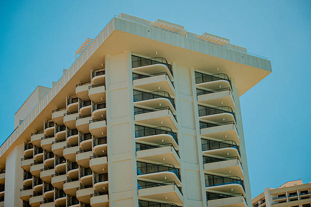 Curved Hotel Balconies Framed By Sky, Soft Midcentury Geometry And Clean Lines Create Minimalist Mood