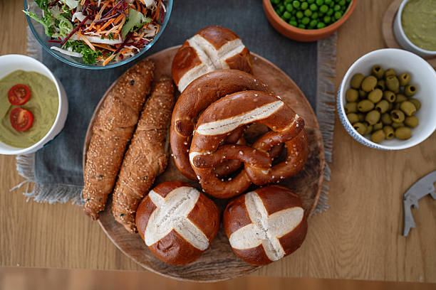 Close-Up of Homemade Bread Rolls, Pretzel and Pastries on Table