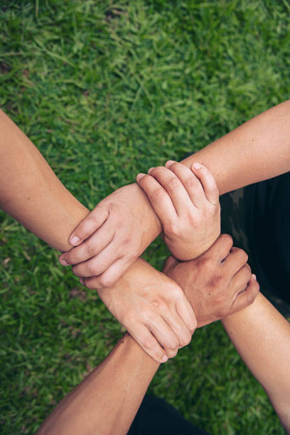 Diversity Teamwork hands stack together trust partner. Businesspeople handshake Leader Trust team handshake promise. MultiEthnics Teamwork high five hands stack shake hands together. Business partner