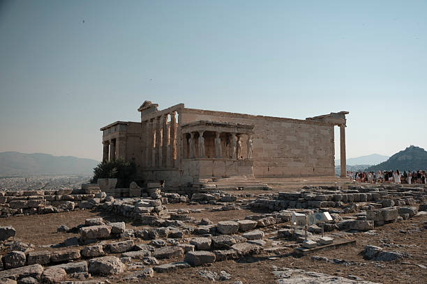 Athens, Greece - July 16, 2025: Ancient greek temple erechtheion with caryatids figures on acropolis