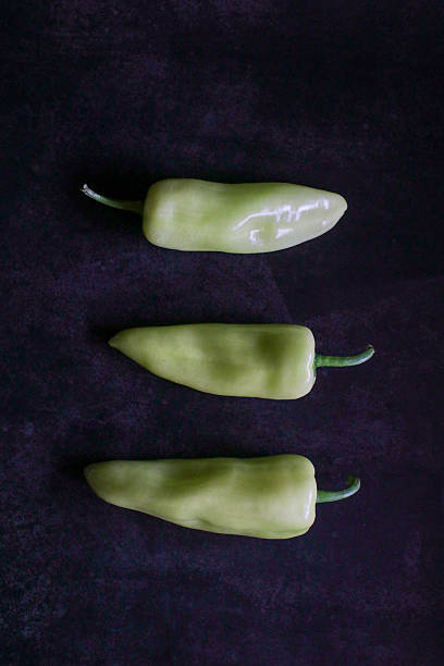 Green pepper chili on dark background. Vegetable concept. Hot chili.