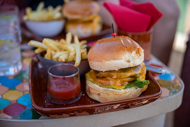 Cheeseburger with fries and dipping sauce