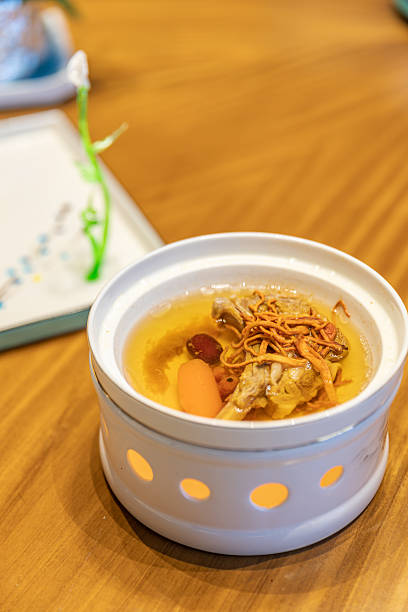 Clear Lamb Chop Soup with Cordyceps Flower in a Ceramic Pot