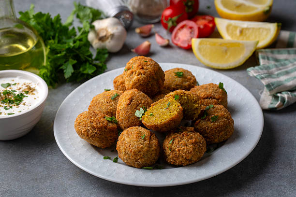 Traditional Middle Eastern Falafel Balls with Yogurt Dip and Lemon