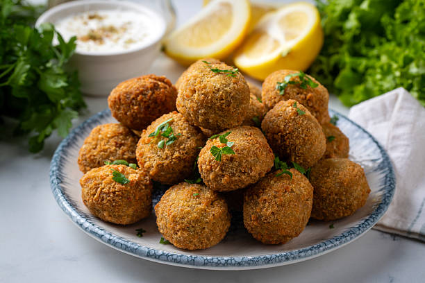 Traditional Middle Eastern Falafel Balls with Yogurt Dip and Lemon
