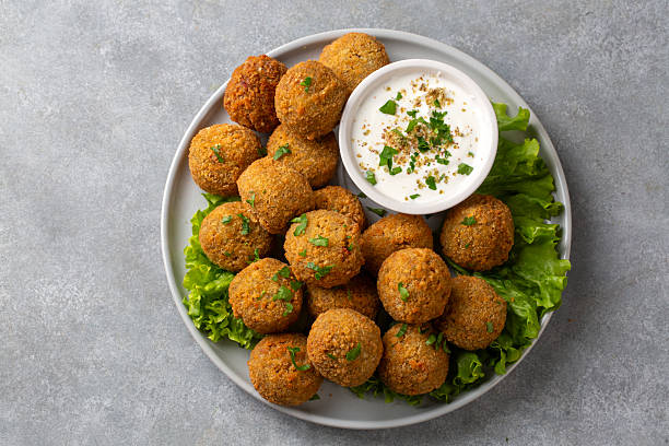 Traditional Middle Eastern Falafel Balls with Yogurt Dip and Lemon